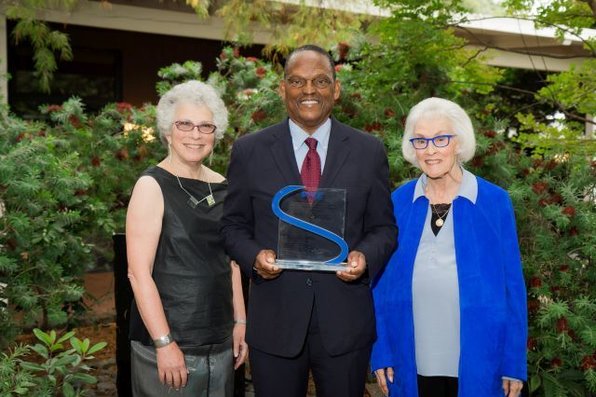 William Julius Wilson poses holding the SAGE-CASBS award with two others.