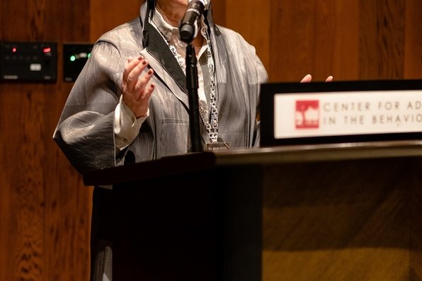 Margaret Levi speaking from the podium.
