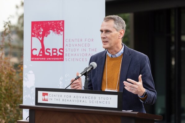 person speaking at the lectern