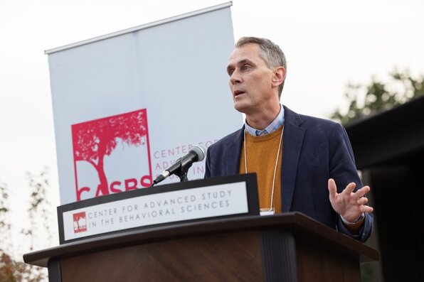 person speaking at the lectern