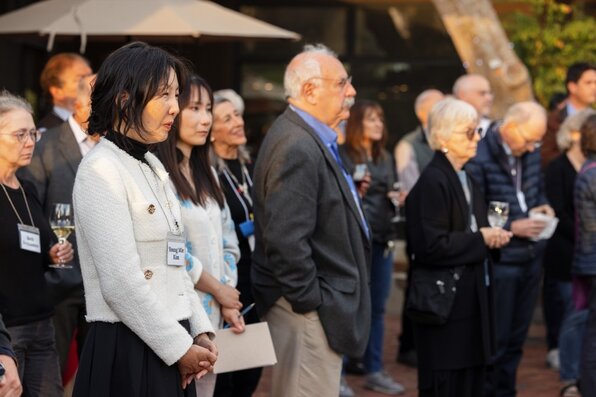people standing and listening