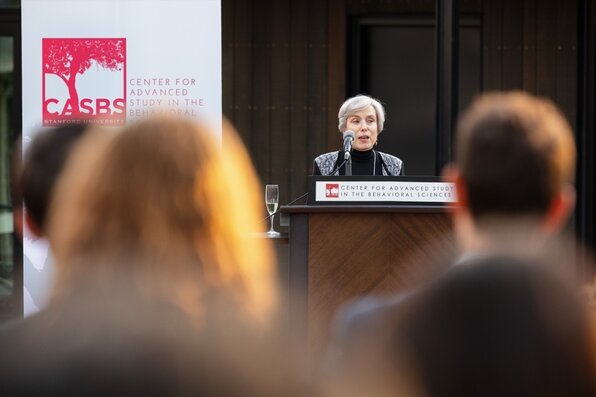 Abby Rumsey speaking at the lectern