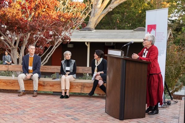 Margaret Levi speaking at the lectern