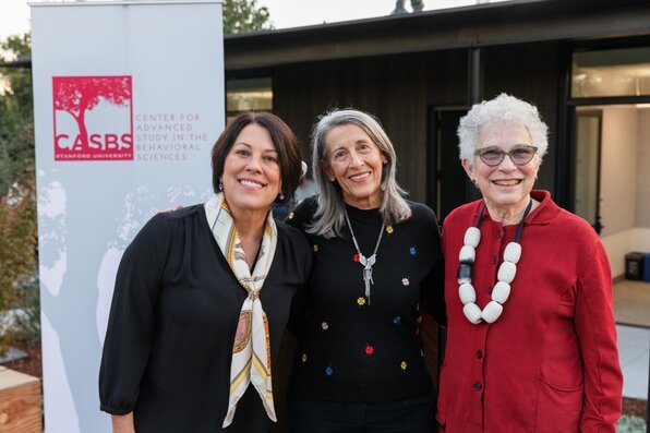 three people standing for a photo