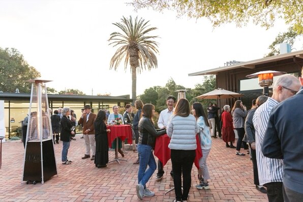 people standing on the patio