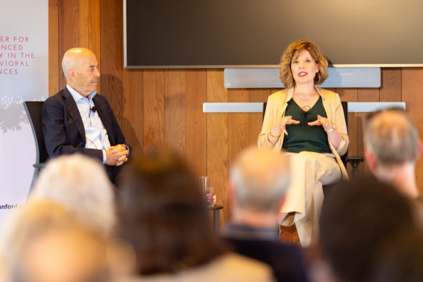 Rachel Peric speaks as Ian Goldin looks on