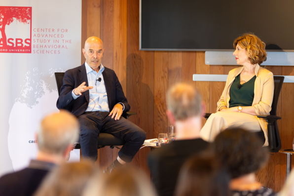 Ian Goldin speaking as Rachel Peric looks on