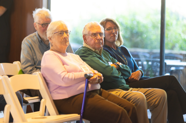 Bob Scott and Julia Fremon watching the panel discussion