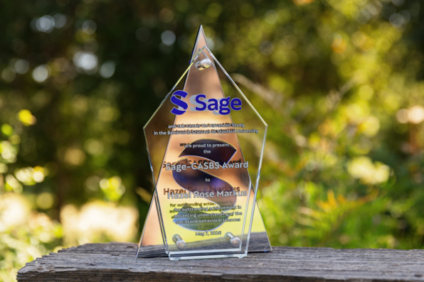 A close-up shot of the Sage-CASBS Award plaque and the inscription on it, taken outside before the event