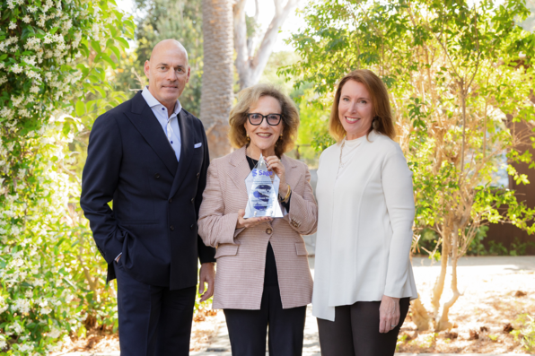 A posed shot of Sage CEO Blaise Simqu & CASBS director Lara Tiedens flanking Hazel Markus, who is holding the Sage-CASBS Award plaque. Taken outside before the event...