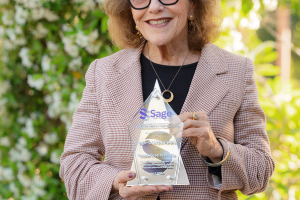 Hazel Markus posing with the Sage-CASBS Award plaque outside before the event