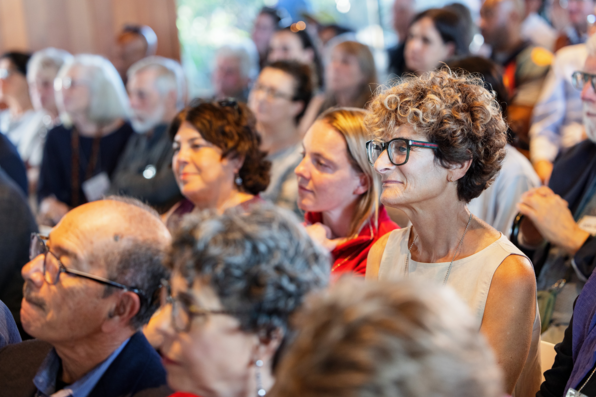 Close-up of audience member Daphna Oyserman, watching Hazel Markus speak