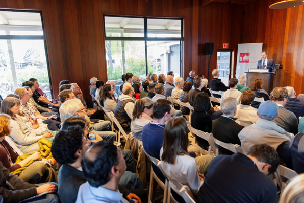 Daron Acemoglu speaking in front of the audience