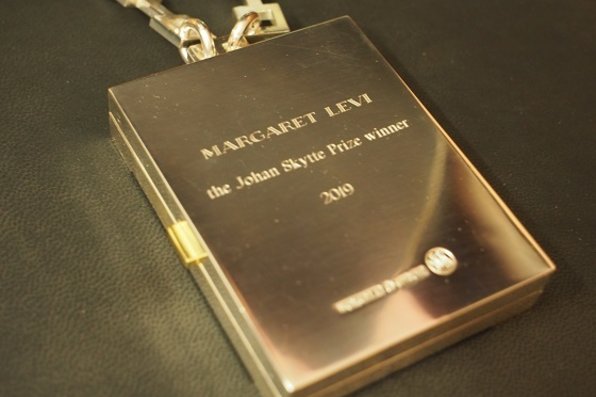 Back of the medal engraved with the words "Margaret Levi - The Johan Skytte Prize winner 2019"