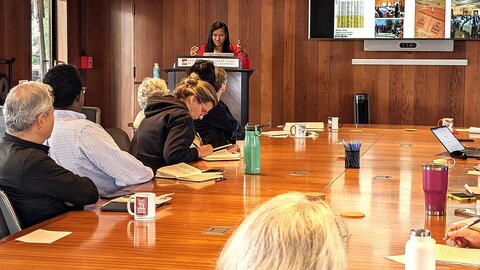 Nasandratra Ravonjiarison speaking from a lectern during her CASBS fellows seminar in April 2026
