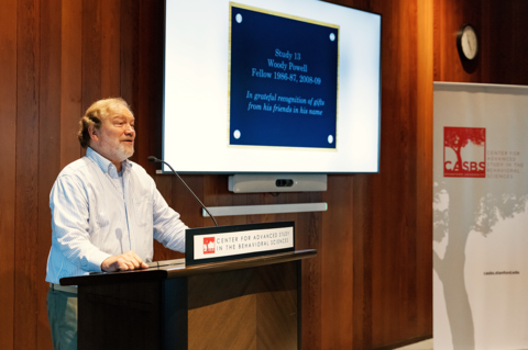 Woody Powell speaking at the CASBS lectern