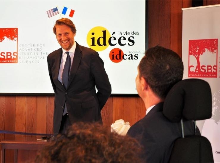 Frédéric Jung smiles as he addresses the CASBS room