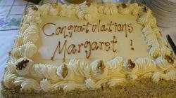 A cake decorated to say, “Congratulations, Margaret!”