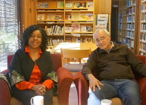 Brenda Stevenson and Professor Arnold Rampersad sit in a library