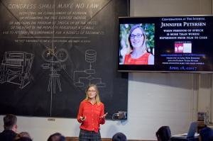 Jennifer Petersen speaking in front of an audience