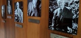 Black and white photos of men involved in CASBS’s history on the wall in their offices