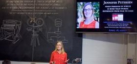 Jennifer Petersen speaking in front of an audience